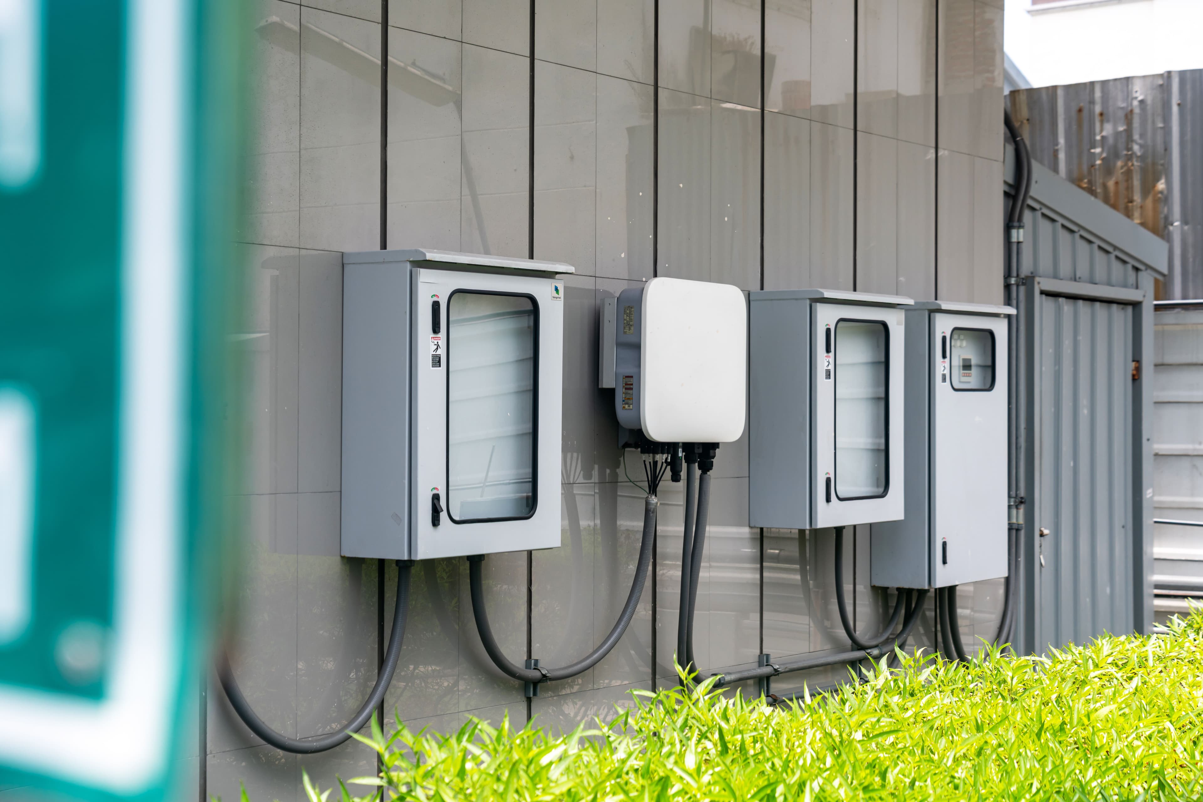 Wall-mounted control enclosures with conduit and cabling
